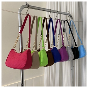 Lightweight felt shoulder bags in nine candy colors with chic chain link accents