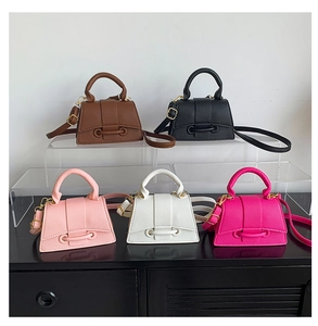 Detailed collection of mini leather trapezoid bags in brown, black, pink, white, and rose