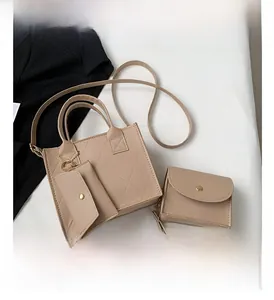 Detailed view of beige quilted PU leather handbag set including small card pouch and clutch