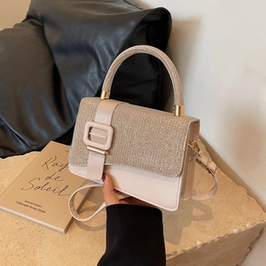 Commuter fashion handbag in cream white leather with glitter trim and gold buckle