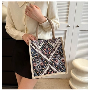 Detail of colorful geometric ethnic woven pattern on high-capacity fashion tote bag