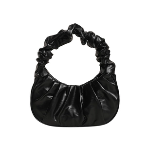 Minimalist black pleated scrunchie handbag made of synthetic leather in cloud bag style
