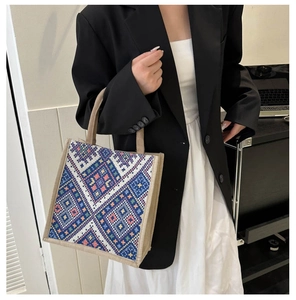 Detail of geometric ethnic pattern weaving on a large capacity tote bag for women