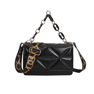 Modern black quilted crossbody bag with resin chain and patterned wide shoulder strap