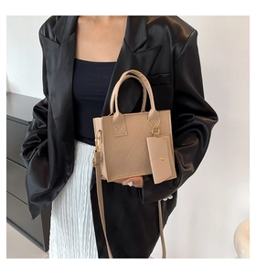 Chic beige crossbody square bag with diamond quilt stitching and detachable pouch detail