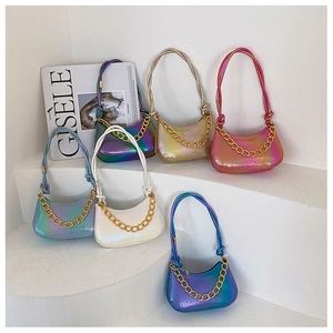 Six colorful gradient embossed shoulder bags with gold chains on tiered display