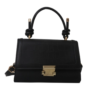 Minimalist black crocodile embossed crossbody bag with gold buckle and knotted top handle