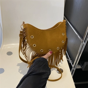 Retro ginger suede crescent bag with fringe details and adjustable shoulder strap