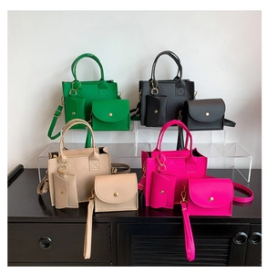 Detailed display of quilted handbag sets in green, black, beige, and magenta