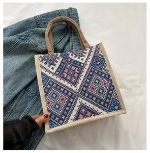 Macro detail of geometric ethnic pattern weaving on durable canvas tote bag