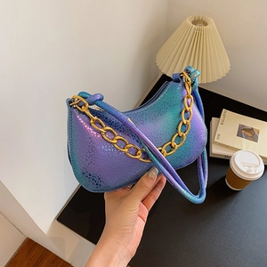 Iridescent snakeskin shoulder bag with gold chain strap in trendy metallic gradients