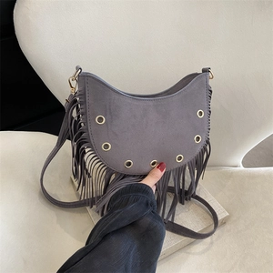 Vintage grey faux suede saddle bag with long tassels and golden metal eyelets decoration