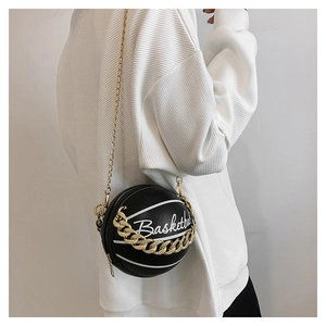Fashionable basketball-shaped crossbody bag shown on a model with gold chains and black PU leather