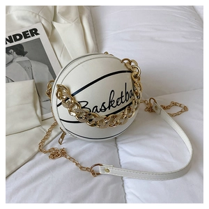 Close-up of white basketball-shaped PU crossbody bag with gold chain and cursive lettering