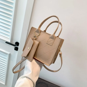 Quilted minimalist beige tote bag and matching pouch with elegant gold hardware