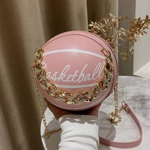 Pink basketball shaped PU leather crossbody bag with chunky gold chain handle and strap