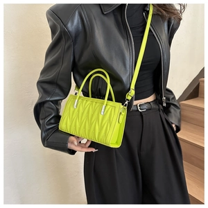 Lime green pleated handbag with cylindrical top handles and silver hardware detail