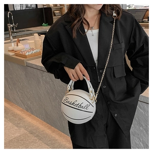 Detail of creative basketball-shaped white leather bag with gold chain and lettering