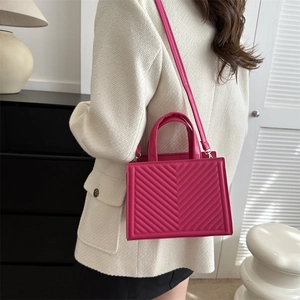 Fashionable rose pink tote bag with V-shaped quilting and removable shoulder strap