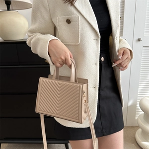 Elegant apricot tote bag with V-quilted pattern and detachable shoulder strap for women