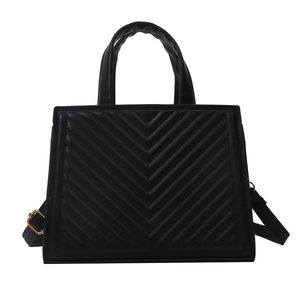 Classic black V-quilted faux leather square handbag with dual handles and gold strap hardware