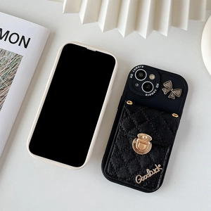 Black quilted iPhone case with gold buckle wallet and bowknot on white background