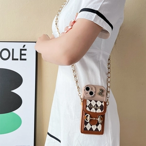 Crossbody phone case with quilted card holder and gold chain shown on a model