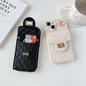 Detail of quilted leather iPhone wallet case with gold clasp and butterfly charm