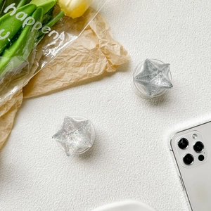Detail of silver metallic and holographic glitter star-shaped collapsible phone grips