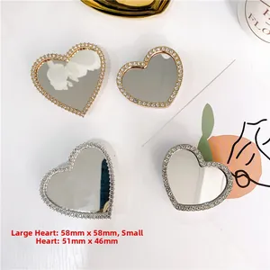Macro detail of heart-shaped rhinestone mirror phone sockets in gold and silver finishes