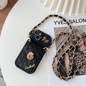 Detail of iPhone wallet case featuring quilted leather pocket, gold buckle, and chain strap