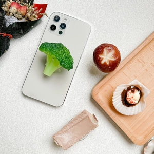 Creative food-shaped telescopic phone grip featuring broccoli and mushroom designs