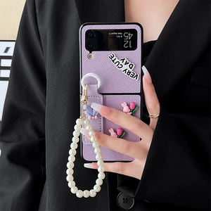 Purple leather Samsung Galaxy Z Flip case with pearl strap, bunny and tulip accents