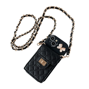 Crossbody iPhone case in black quilted leather with gold chain and butterfly detail