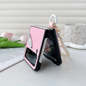 Detail of Galaxy Z Flip6 case featuring pearl wrist strap and cute pink tulip floral decor