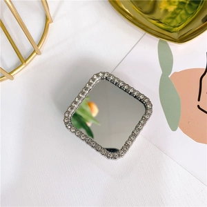 Macro detail of luxury square mirror phone holder with glittering rhinestone borders