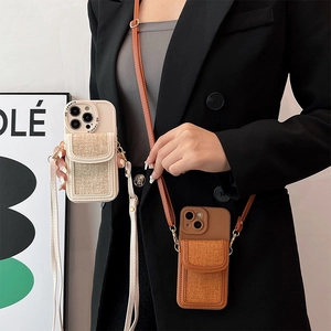 Crossbody iPhone case with adjustable strap and detachable wallet in cream and caramel