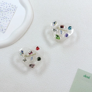 Heart-shaped acrylic phone grip with multi-colored rhinestones and golden Diamonds text