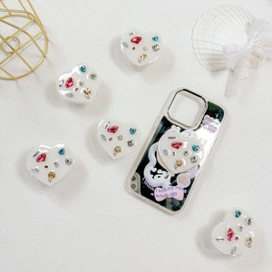 Luxe heart-shaped collapsible phone grip with colorful rhinestones on a white background