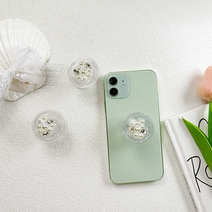 Support de téléphone en résine scintillante avec perles et strass sur mobile vert