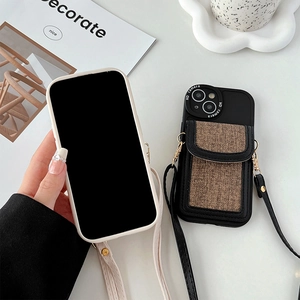 Detail view of iPhone wallet case with crossbody strap and leather card holder slot