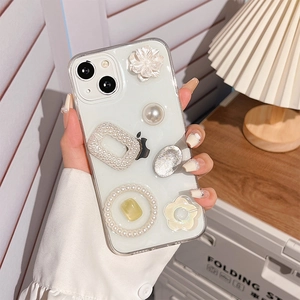 Detailed shot of iPhone case with 3D camellia flowers and pearl frame decoration