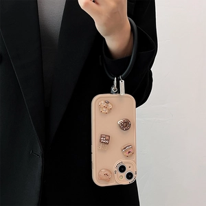 Beige silicone iPhone case with 3D cartoon bear charms and black wrist strap ring