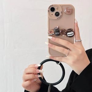 Detail of pink silicone iPhone case with 3D resin bear, coffee, and donut charms