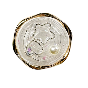 Phone grip with golden wave edge, resin heart, star charms and white pearl embellishment