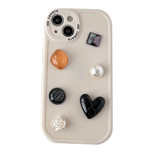 iPhone 16 Pro Max case with 3D floral, heart, and rhinestone gems on off-white base