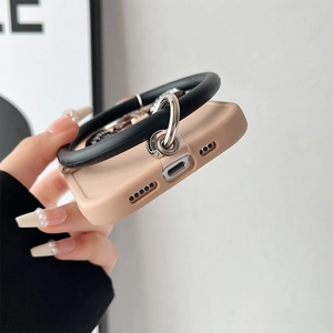 Close-up of precise cutouts for charging port and speakers on pink protective phone case