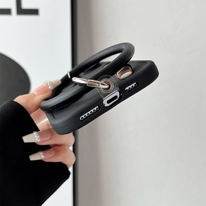 Detail of coffee-themed iPhone case showing precision port cutouts and wrist strap hook