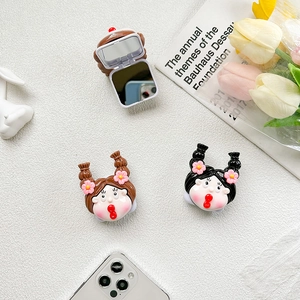 Close-up of cute cartoon girl phone grip with built-in folding makeup mirror design