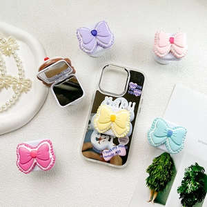 Pastel bow collapsible phone grip with hidden makeup mirror on mirror finish case
